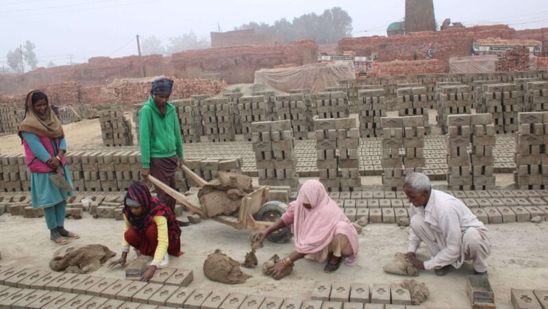 Azeeb and his family working in the kiln.
